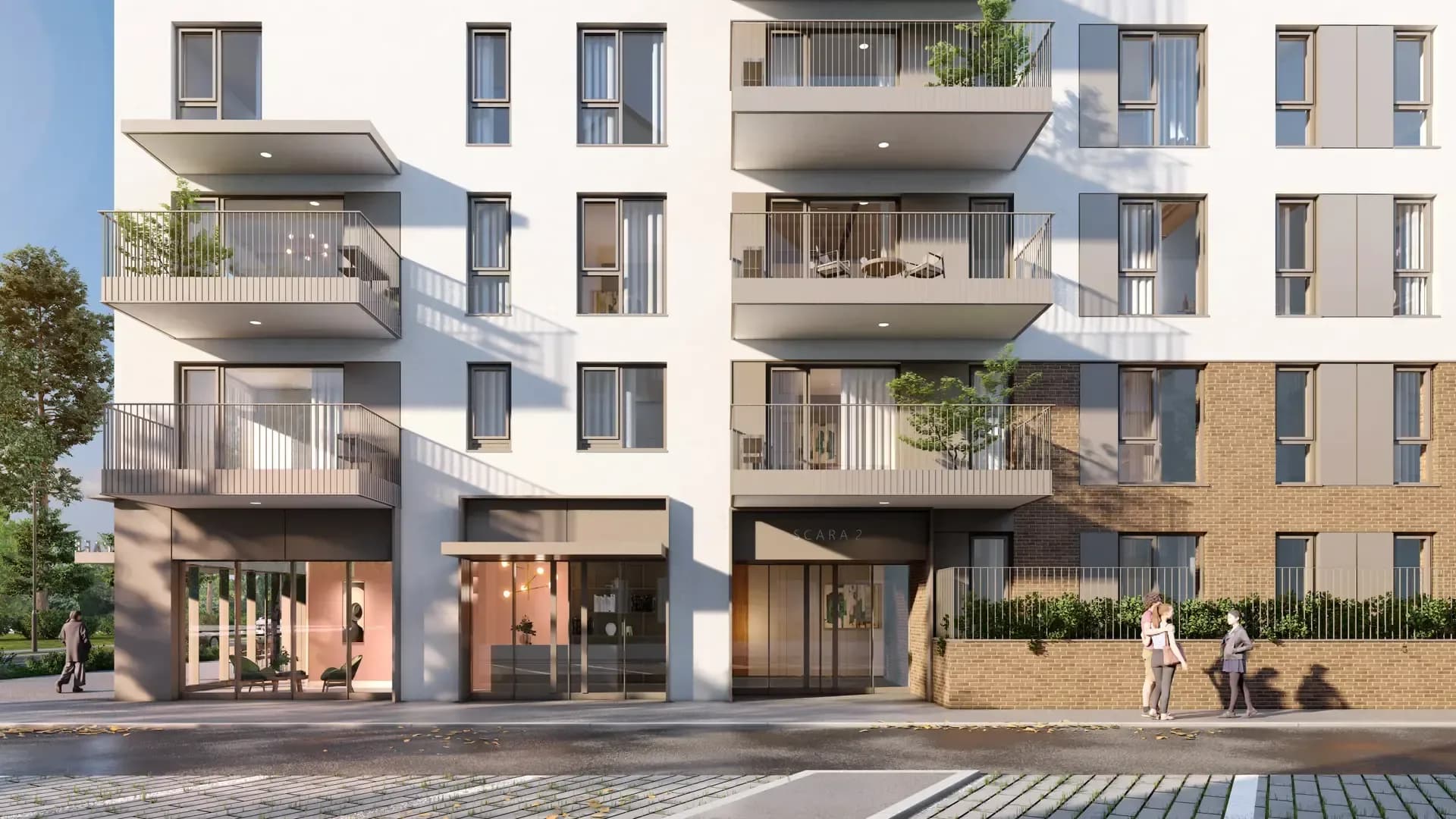 Residential building facade with balconies and a landscaped street
